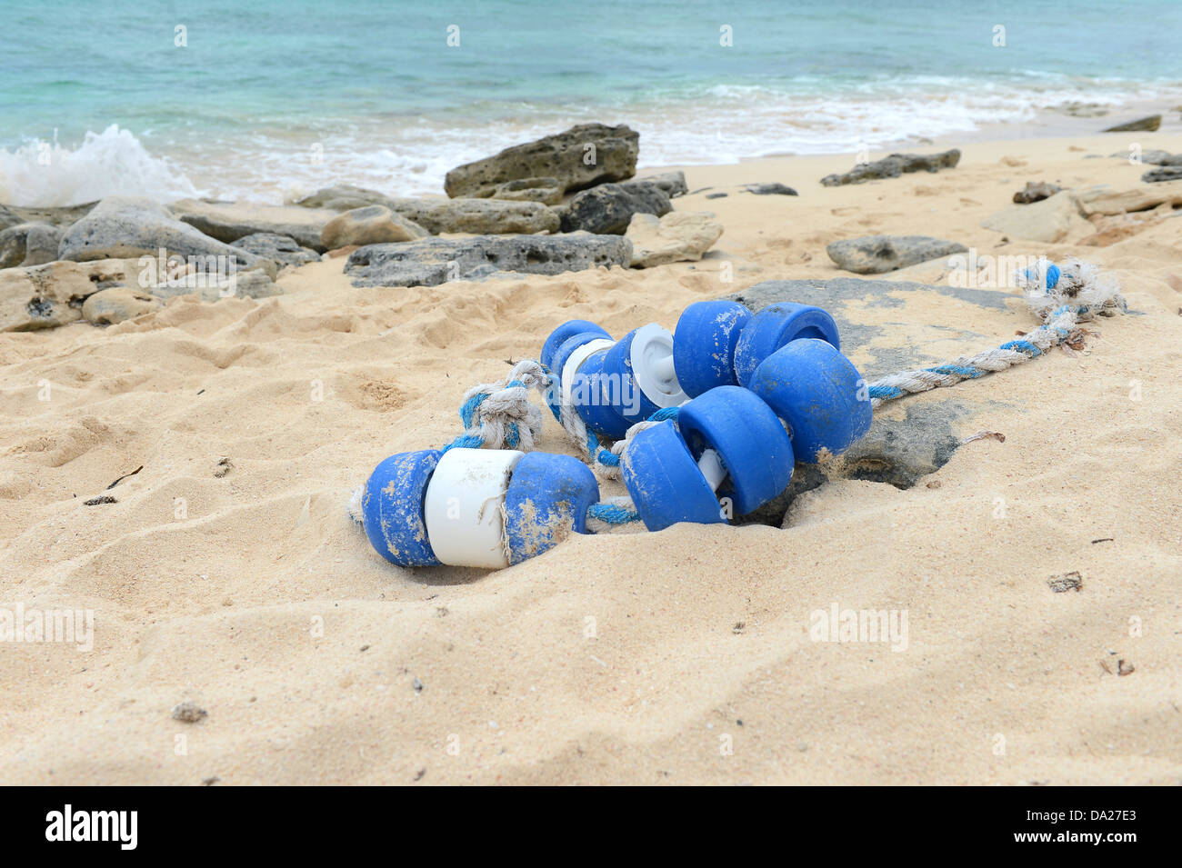 Debris from fishing nets on tropical beach in Caicos Island Stock Photo