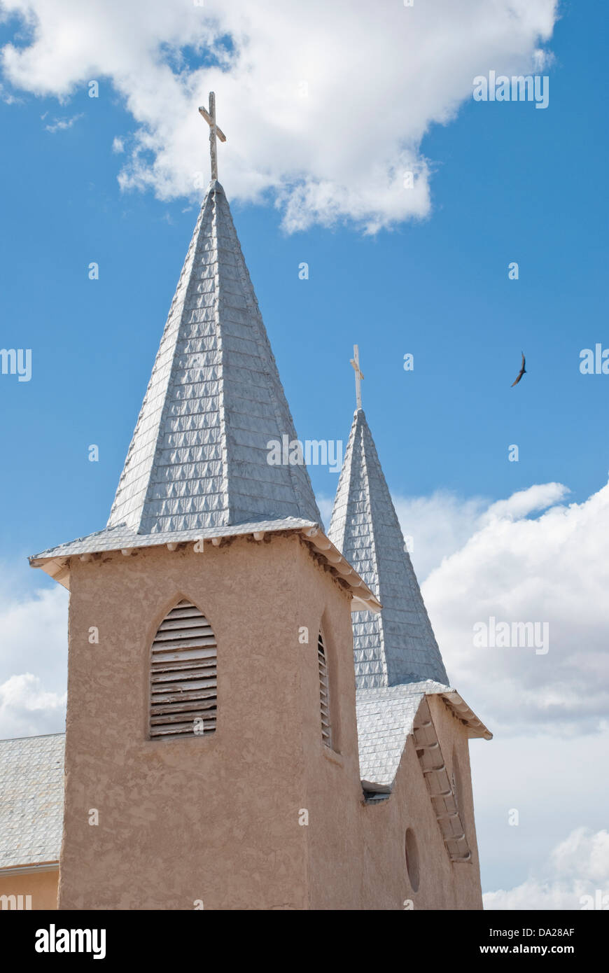 A doublesteepled church in Anton Chico reflects the bright sunlight in this small New Mexico