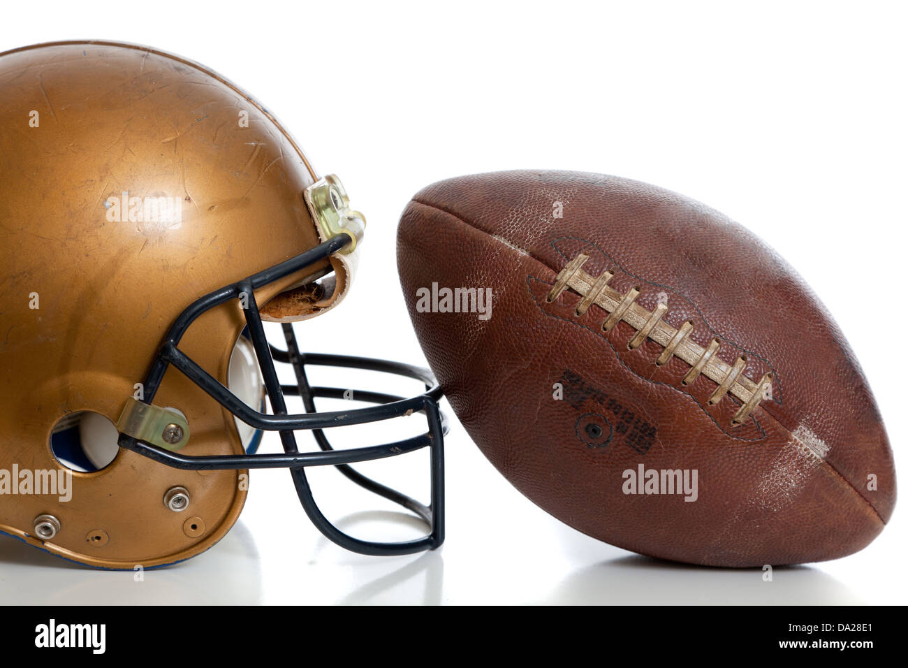 A retro football helmet and football on a white background Stock Photo