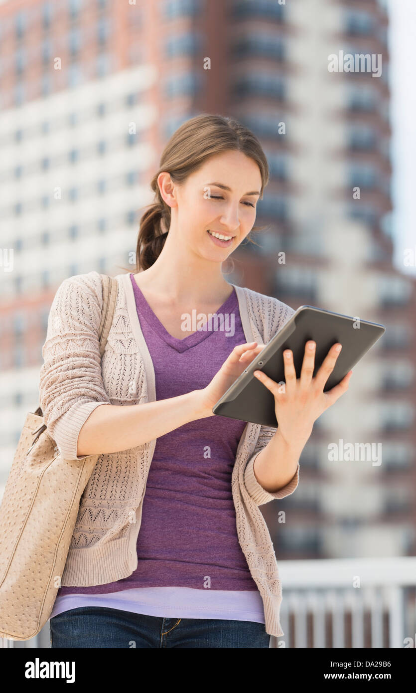 Young female using digital tablet Stock Photo