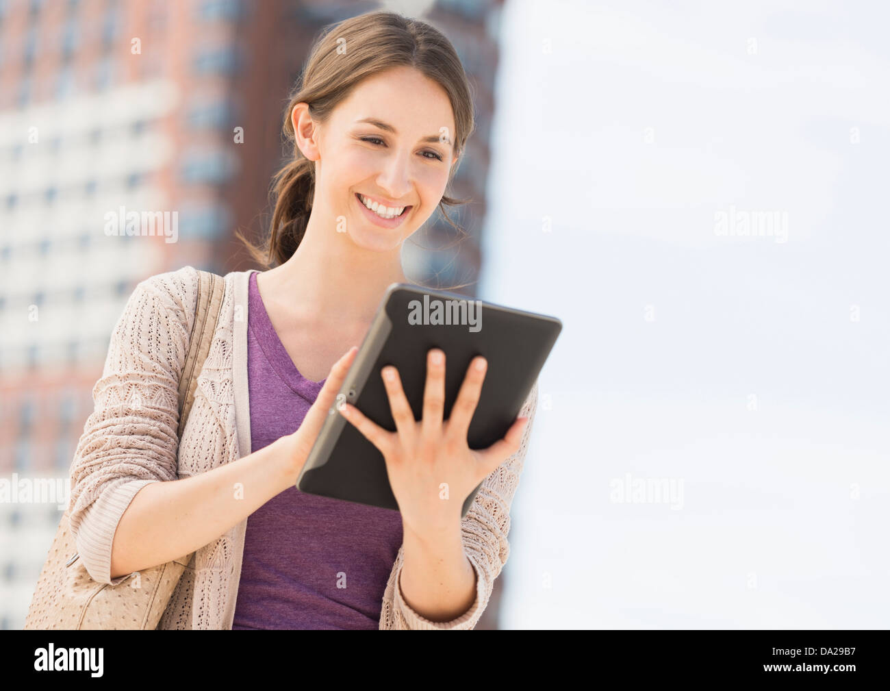 Young female using digital tablet Stock Photo
