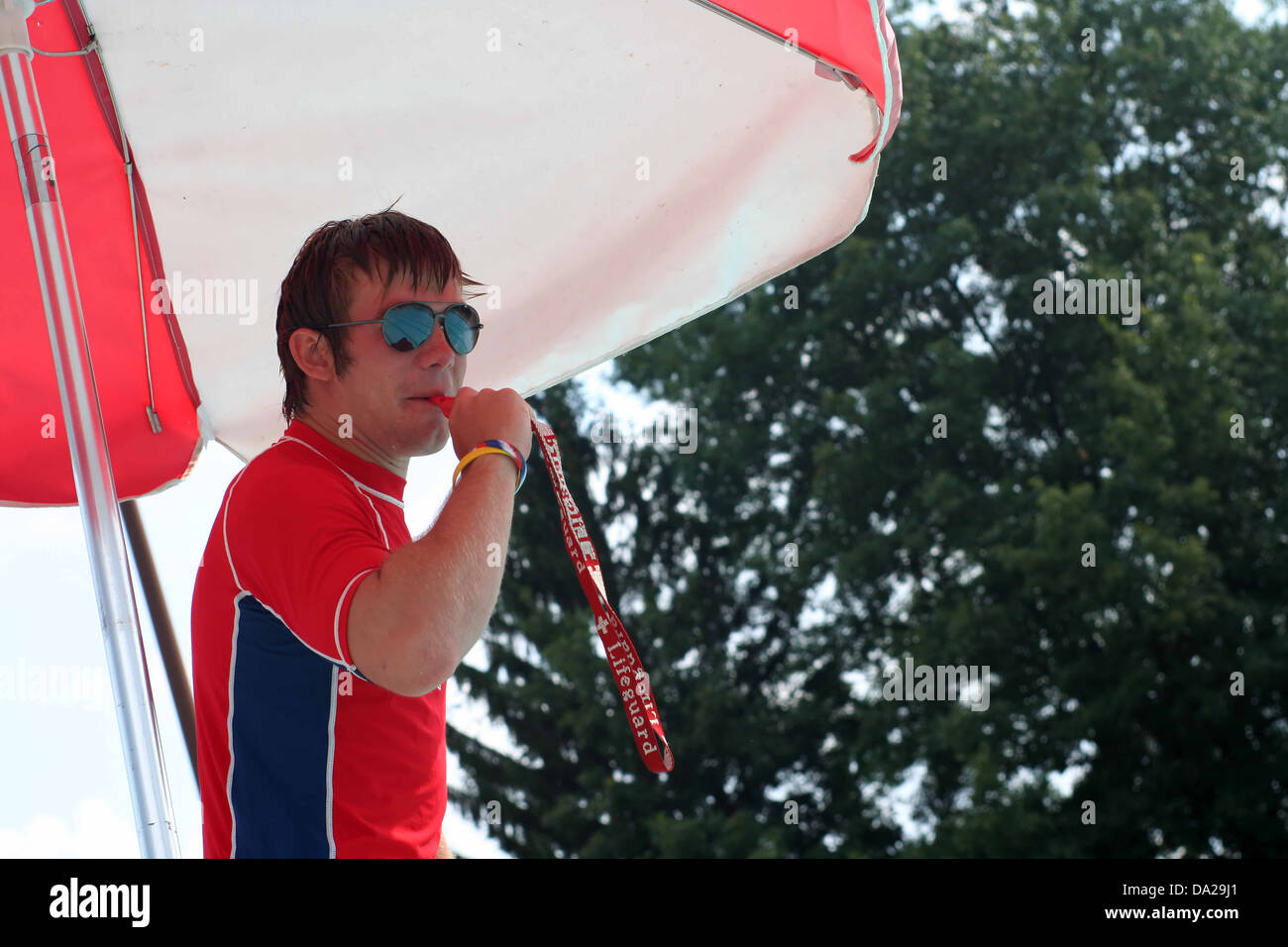 lifeguard guard whistle sun sunglasses safe safety water rescue alert  rescuer rescues lifeguards water swim pool swimming Stock Photo - Alamy