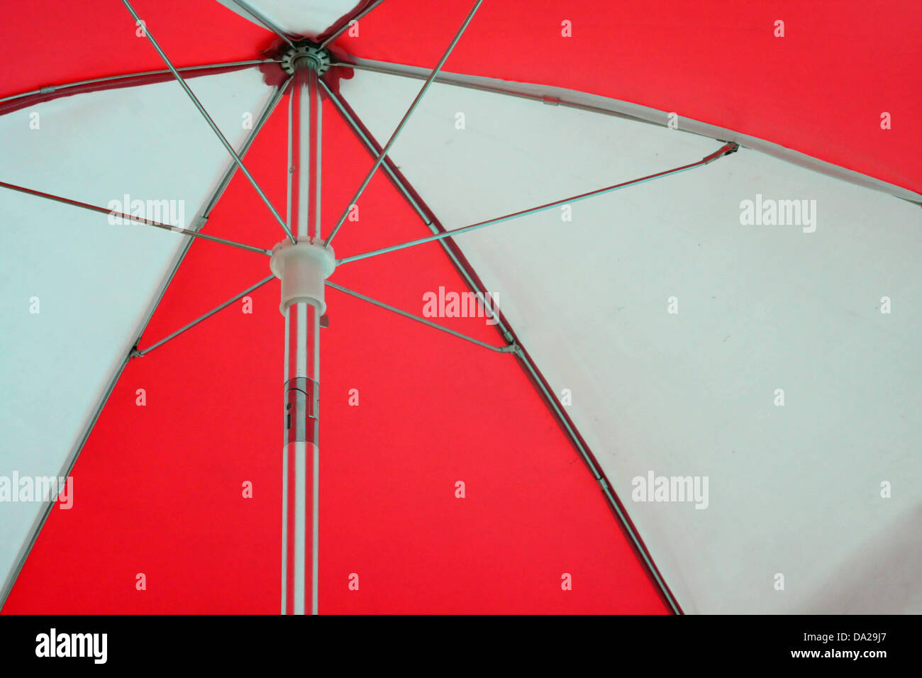red white umbrella beach sun rain lifeguard lifeguards umbrellas weather forecast Stock Photo
