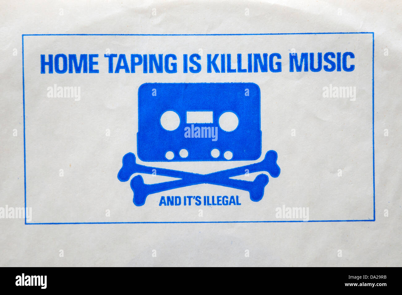 A printed warning on a record inner sleeve saying 'home taping is killing music' Stock Photo