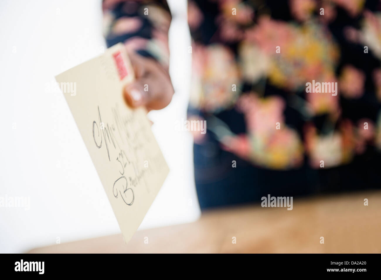 Close up of woman's hand holding letter Stock Photo Alamy