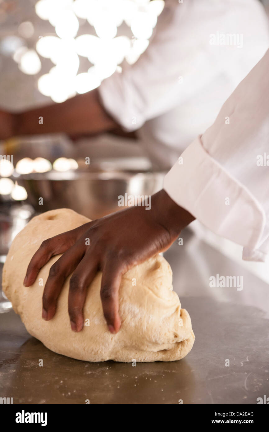 african american women making cinnamon buns from scratch Stock Photo