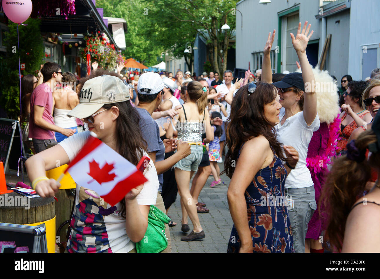 People disco dancing outdoors at Canada Day celebrations on Granville Island in Vancouver, British Columbia, Canada Stock Photo