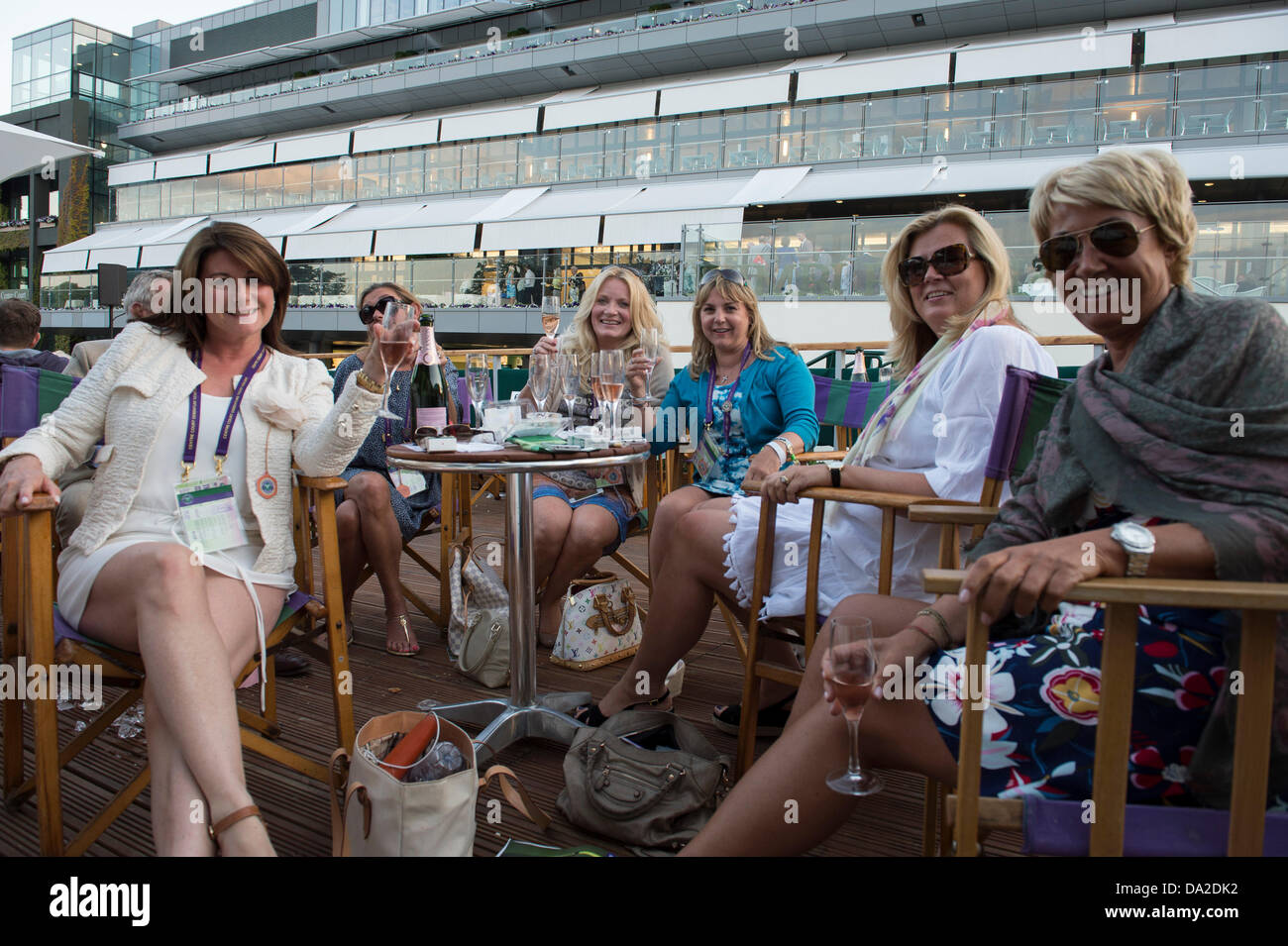 Wimbledon, london, UK. 1st July 2013. The Wimbledon Tennis Championships 2013 held at The All England Lawn Tennis and Croquet Club, London, England, UK.    General View (GV).  Tennis fans having enjoyed dome great Wimbledon tennis and some great Wimbledon champagne. Credit:  Action Plus Sports Images/Alamy Live News Stock Photo