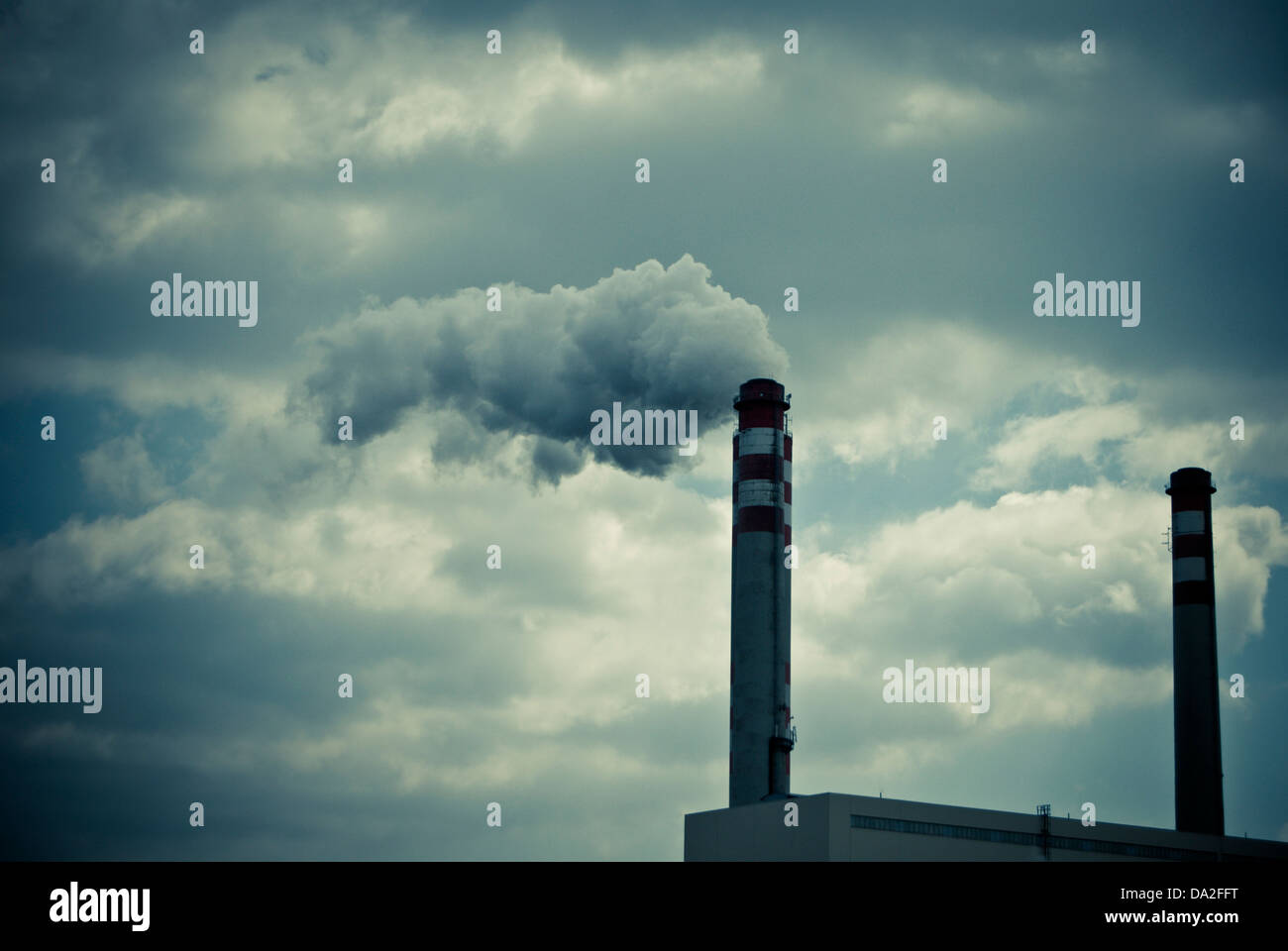industrial chimneys emitting smoke Stock Photo - Alamy