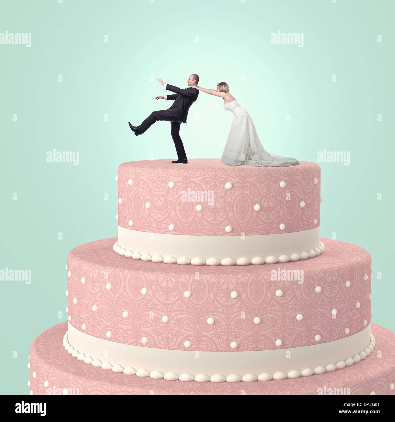funny wedding cake with goom and bride Stock Photo - Alamy