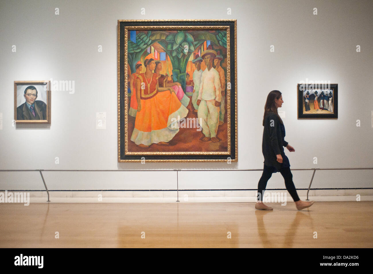 London, UK - 2 July 2013: A Royal Academy of Arts employee walks past a work by Diego Rivera entitled 'Dance in Tehuantepec, 1928' at the exhibition 'Mexico: A Revolution in Art, 1910–1940' which opens on the 6th of July. The show features over 120 paintings and photographs and examines the intense period of artistic creativity that took place in Mexico at the beginning of the 20th century. Credit:  Piero Cruciatti/Alamy Live News Stock Photo