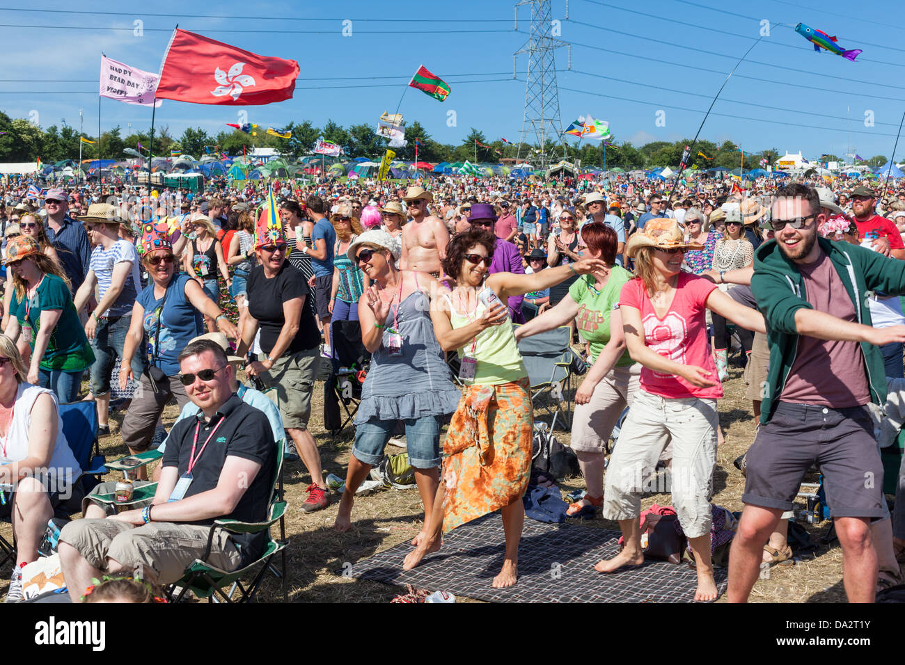 GLASTONBURY FESTIVAL, UNITED KINGDOM - JUNE 30 2013 : Audience members sway to the music of Kenny Rogers Stock Photo