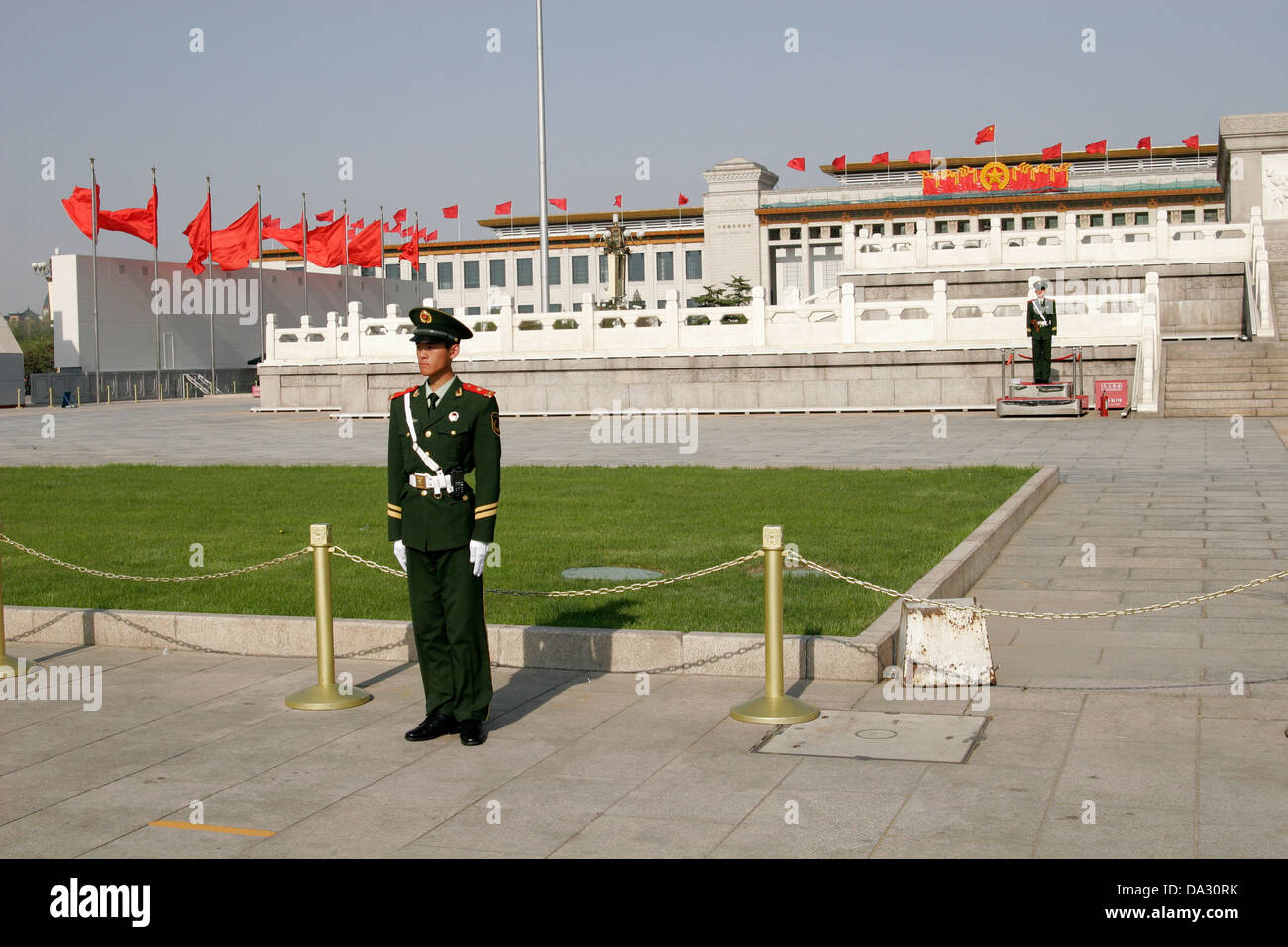 Chinese soldier standing Tiananmen Square with red flags on the Labor Day 1st of May, Beijing Stock Photo