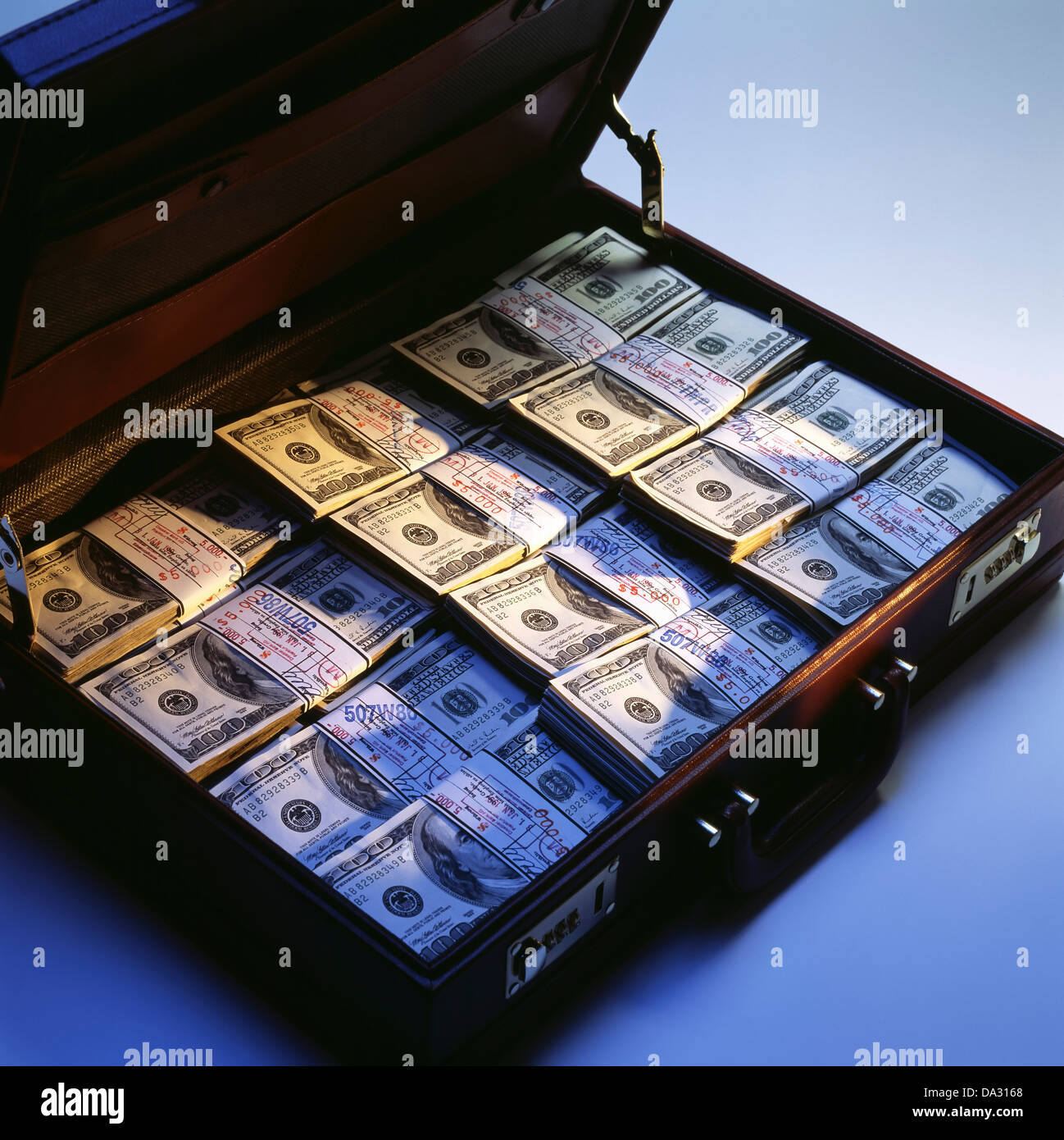 Briefcase with stacks of bundled 100 US Dollar bills Stock Photo