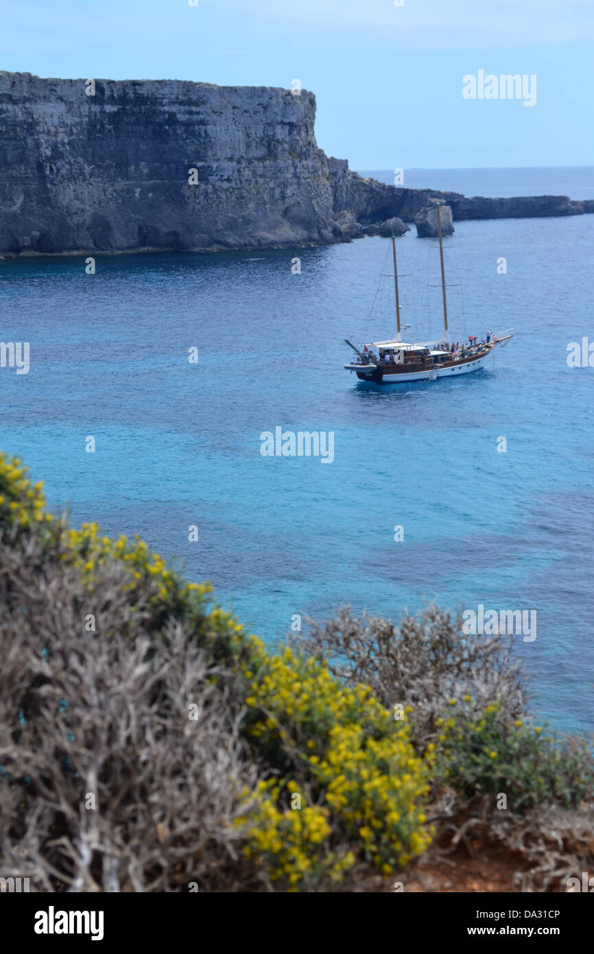 View of boat from Comino island, Malta. Stock Photo
