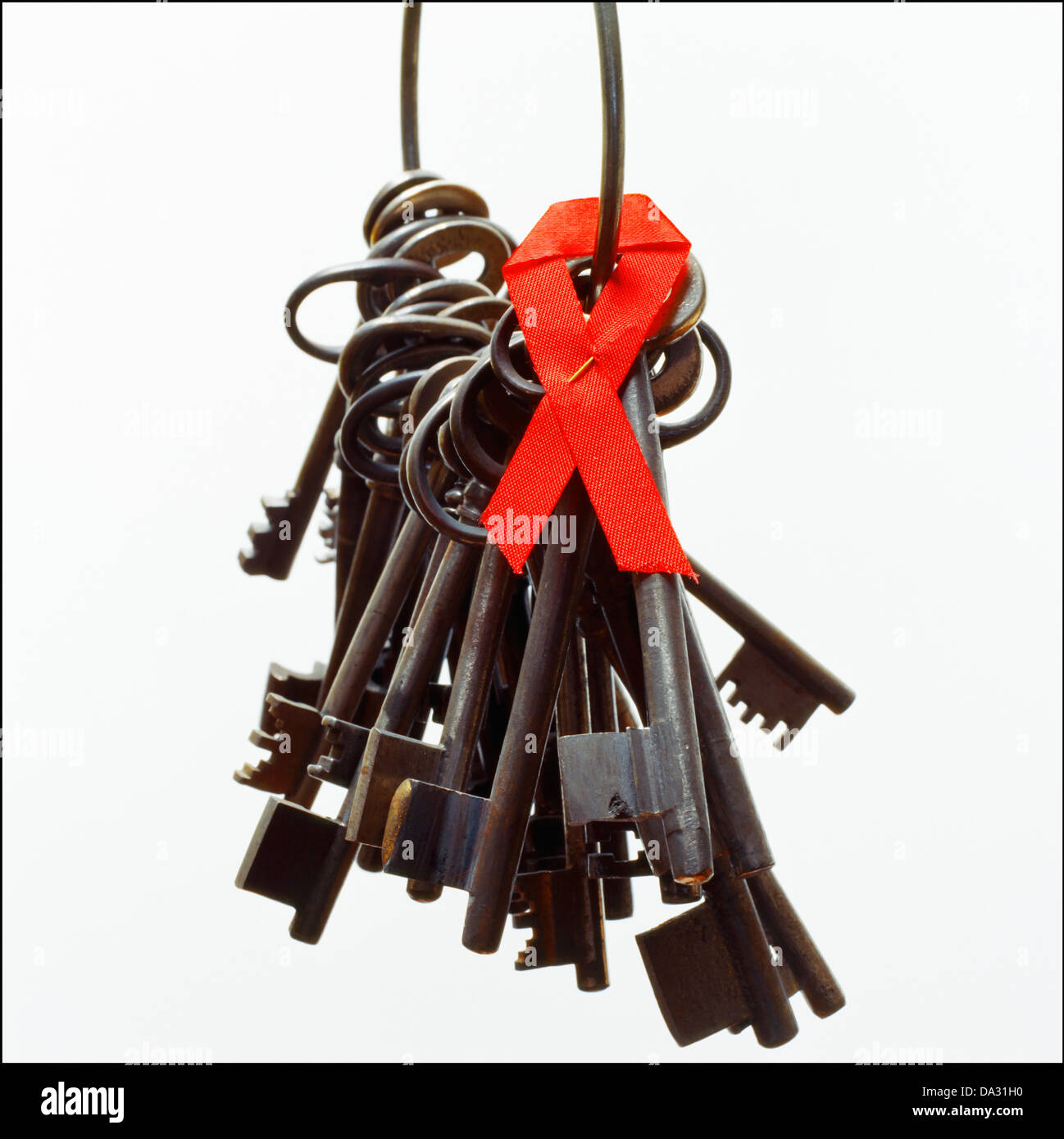 Bunch of ancient keys with Aids awareness ribbon Stock Photo