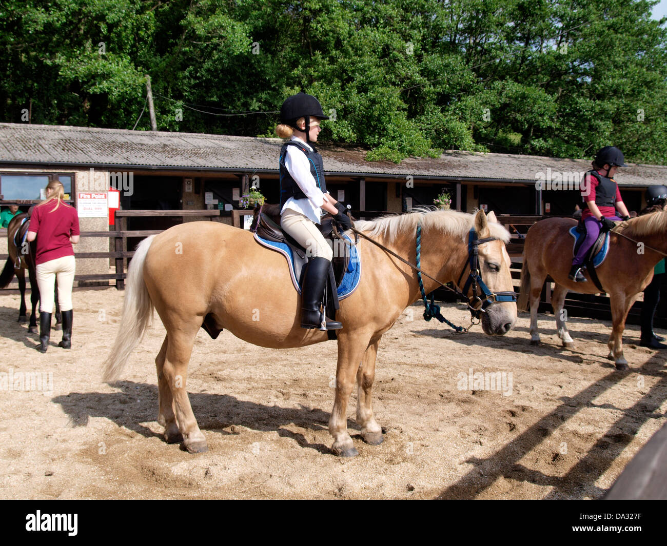 Young girls at a riding school, UK 2013 Stock Photo