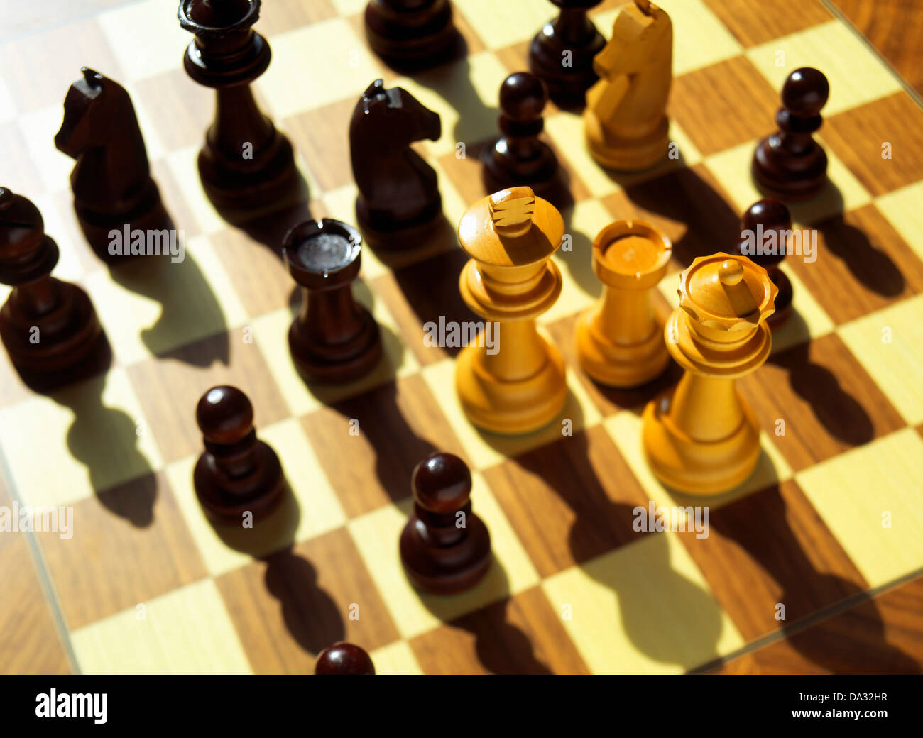Chessmen on chessboard Stock Photo