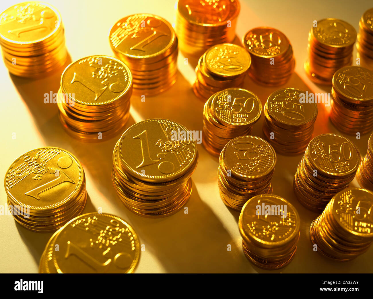 Piles with golden Euro coins Stock Photo