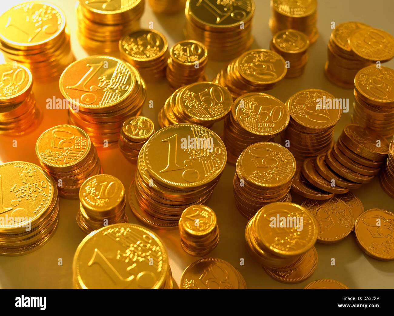 Stacks with golden Euro coins Stock Photo