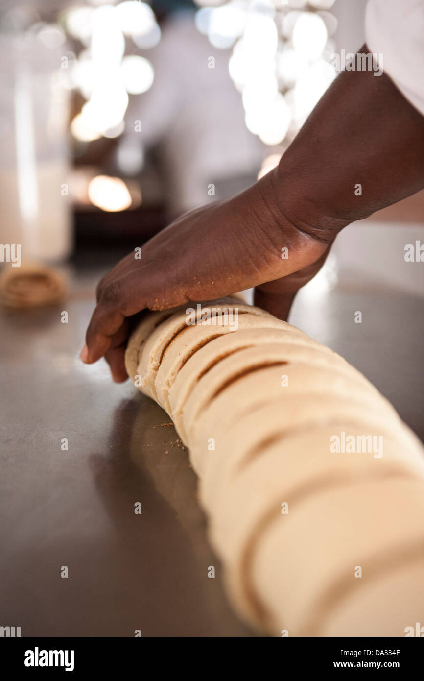 african american women making cinnamon buns from scratch Stock Photo