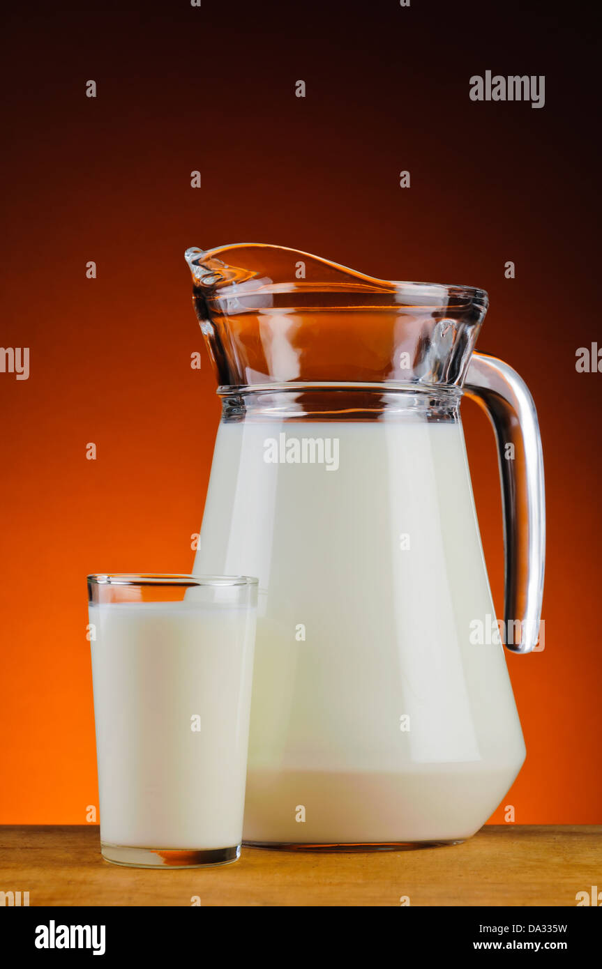 still life with glass and jug of fresh organic milk Stock Photo