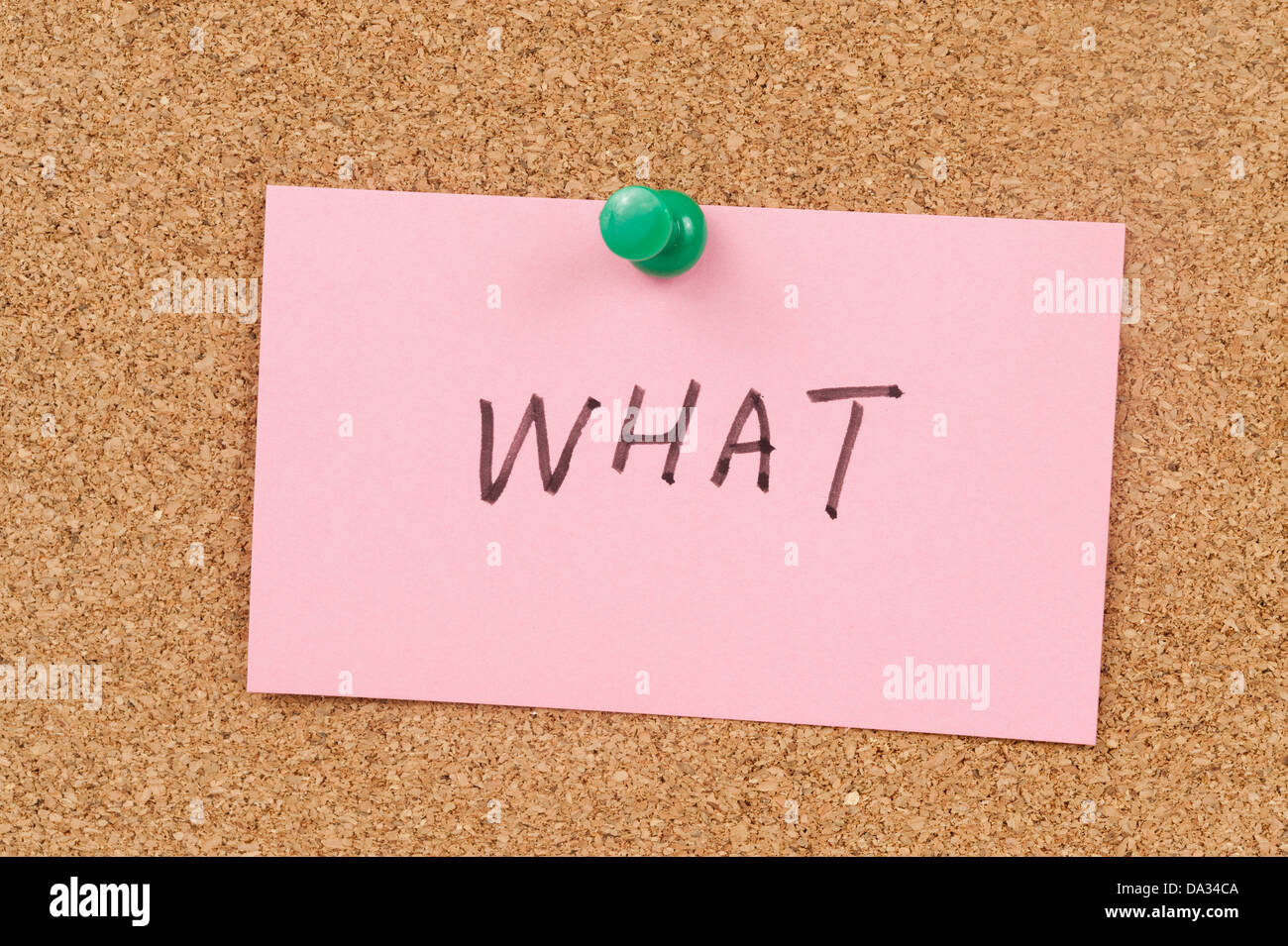 What word written on paper and pinned on cork board Stock Photo