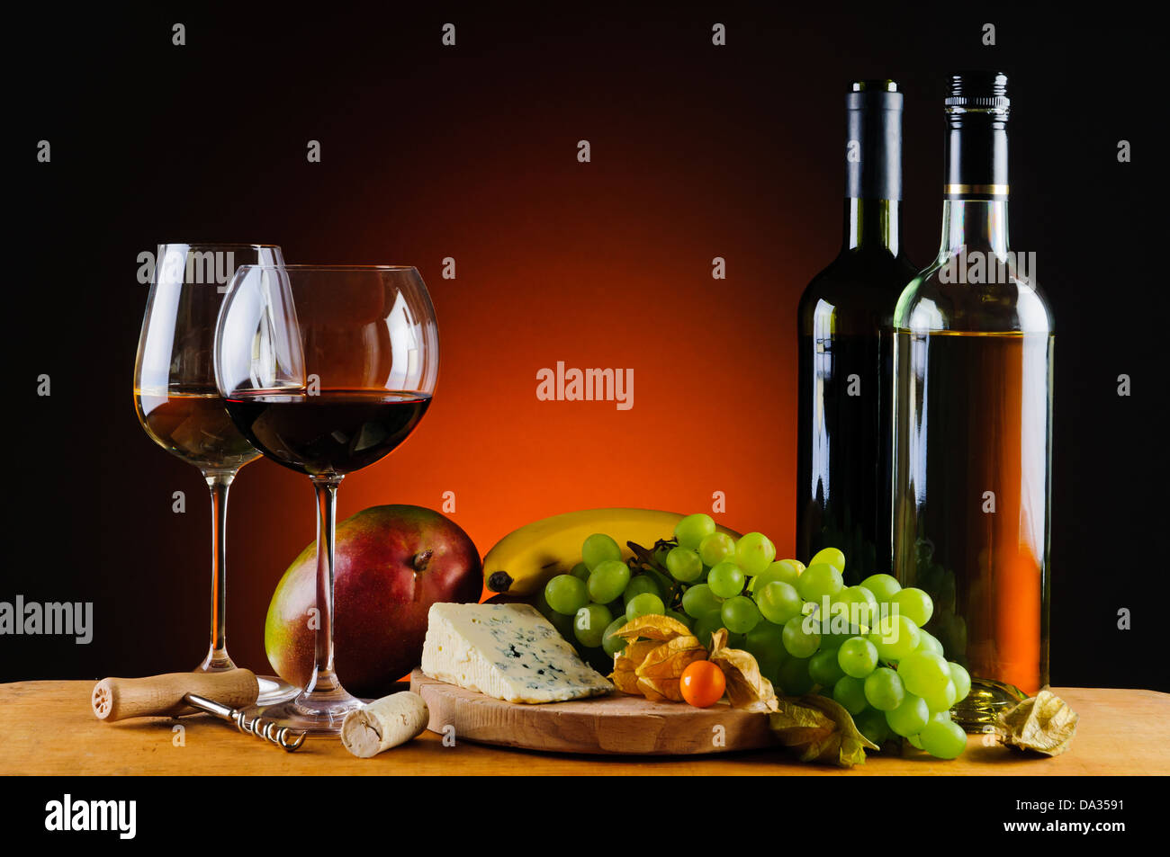 still life with cheese, wine and fresh exotic fruits Stock Photo - Alamy