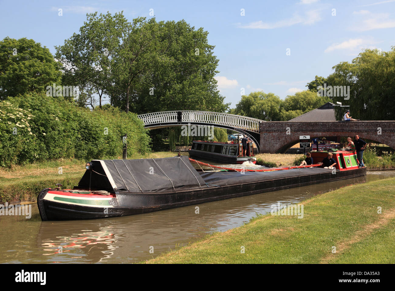 An historic working narrowboat travelling from the Grand Union Canal to the Oxford Canal at Braunston Turn, Northamptonshire Stock Photo