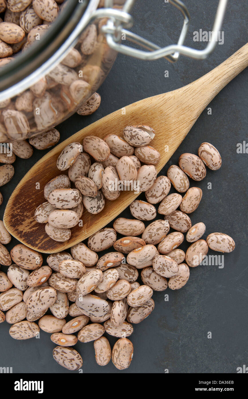 Pinto beans with selective focus on the beans on the spoon Stock Photo