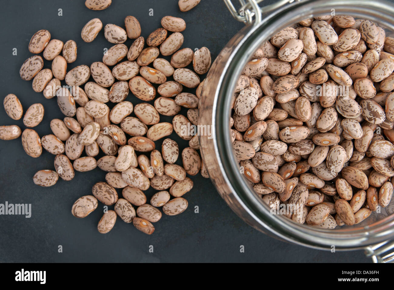 Pinto beans in a glass storage jar top down view Stock Photo