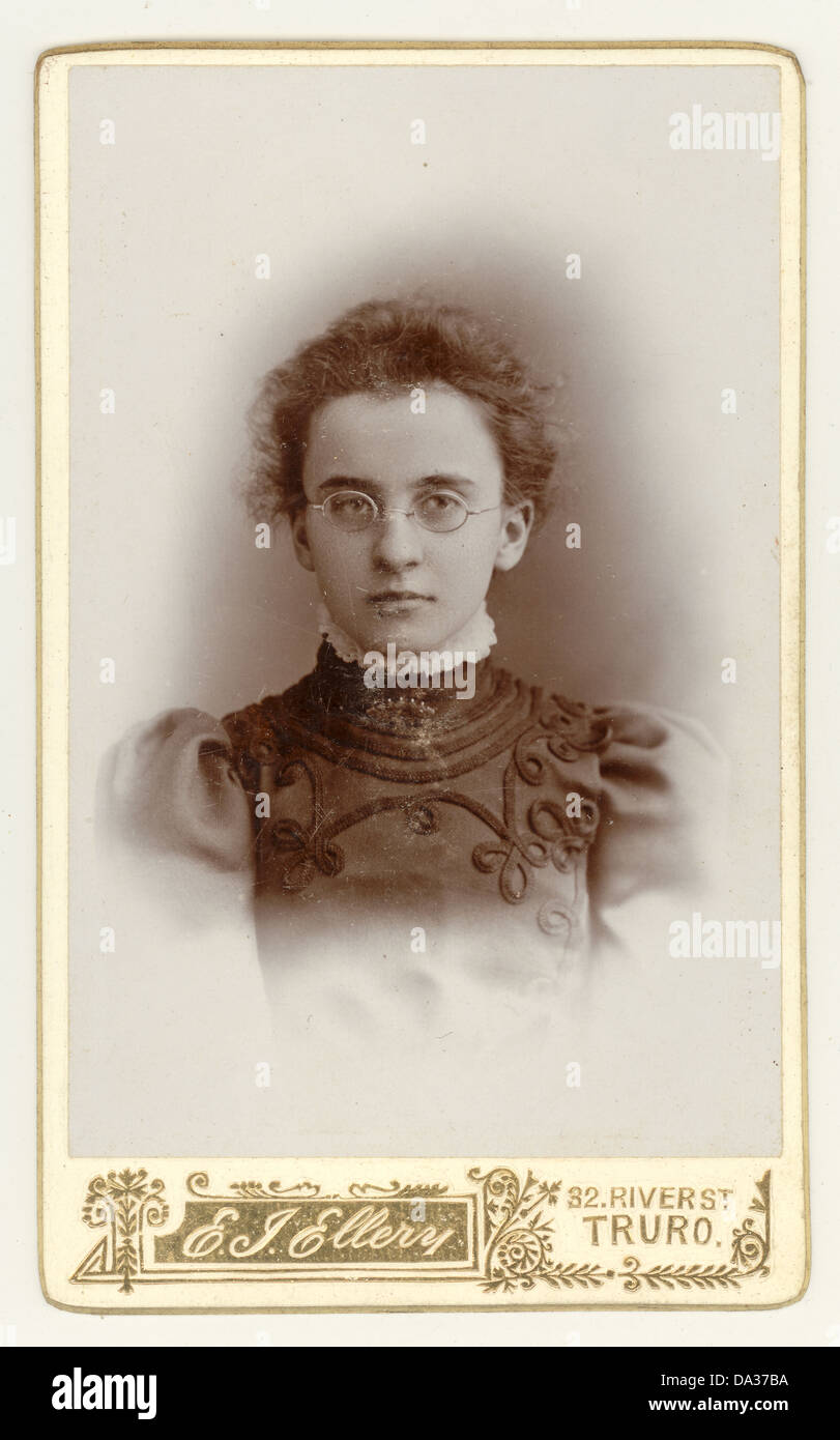 Original Victorian cartes de visite (CDV) portrait of serious young Victorian girl wearing glasses. From the photographic studio of E.J. Ellery, Truro, Cornwall, England, U.K. circa 1898 Stock Photo