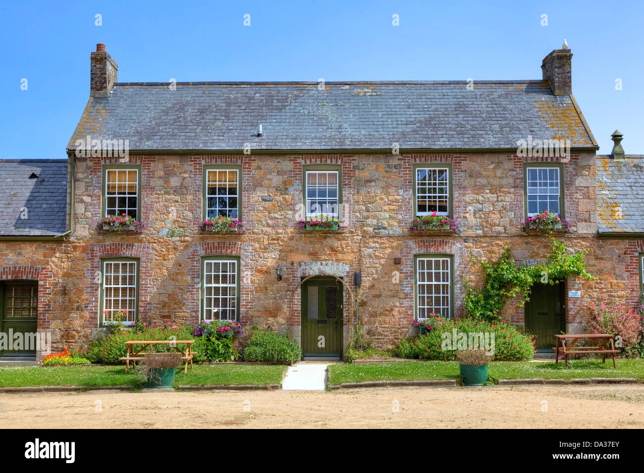 typical Jersey cottage on the ground of Samares Manor, Jersey, United Kingdom Stock Photo