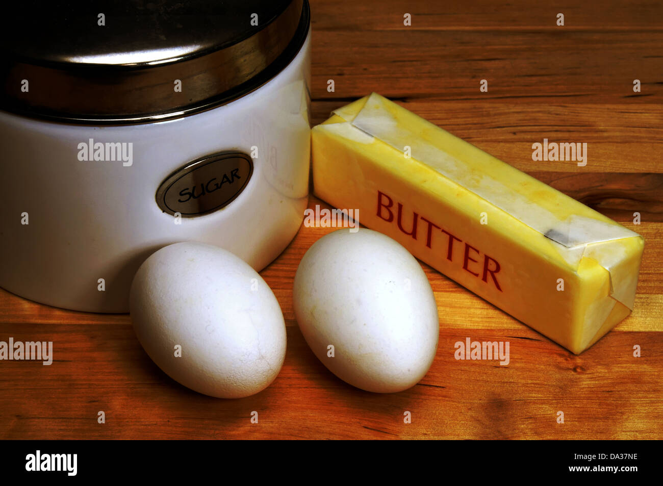 These are essential ingredients for baking. Butter, eggs, and sugar should be in every baker's kitchen at all times. Stock Photo