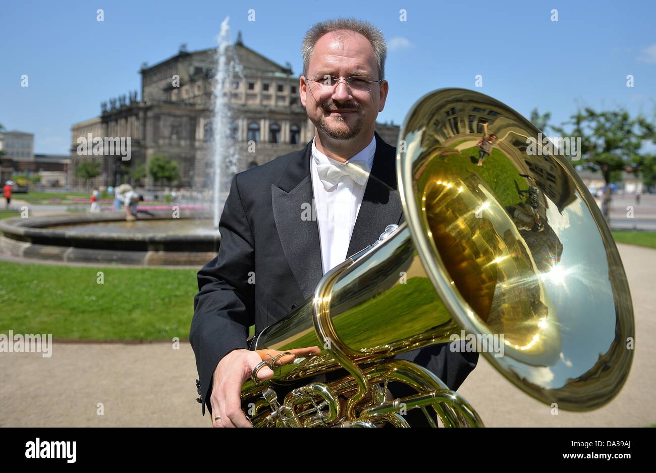 Professor Joerg Wachsmuth, tuba soloits with the Dresden Philharmonie,  stands with his tuba outside of the Semper Opera in Dresden, Germany, 02  July 2013. For the opening of the Dresden city festival
