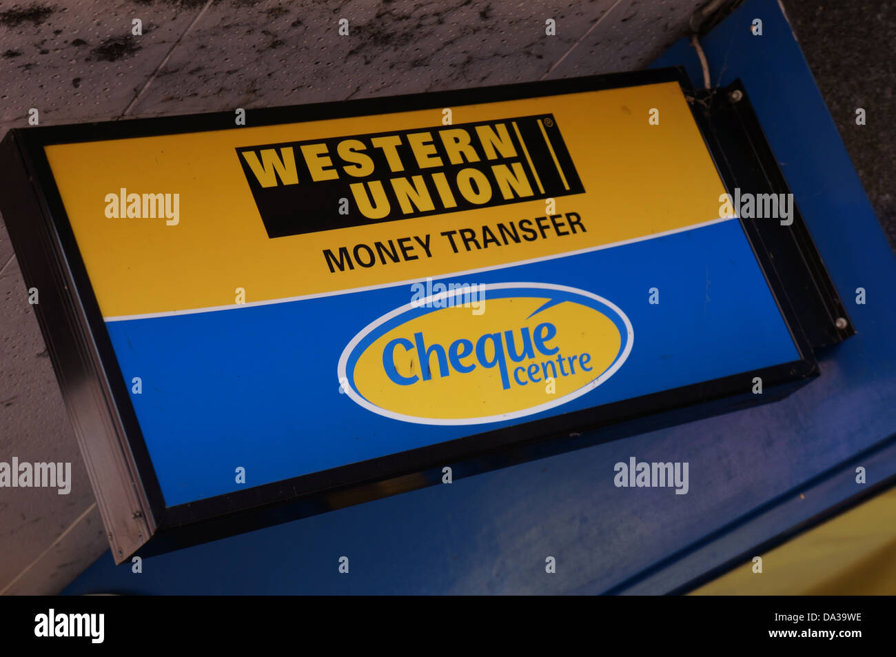 western union money transfer sign on cheque centre shop front Stock Photo