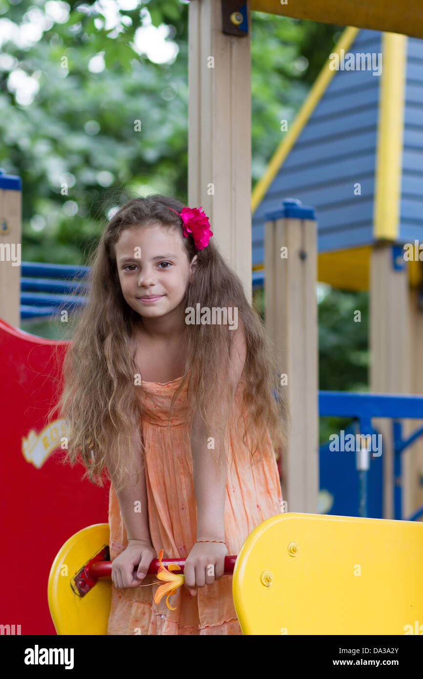 Cute little schoolgirl on the playground at summer day Stock Photo - Alamy