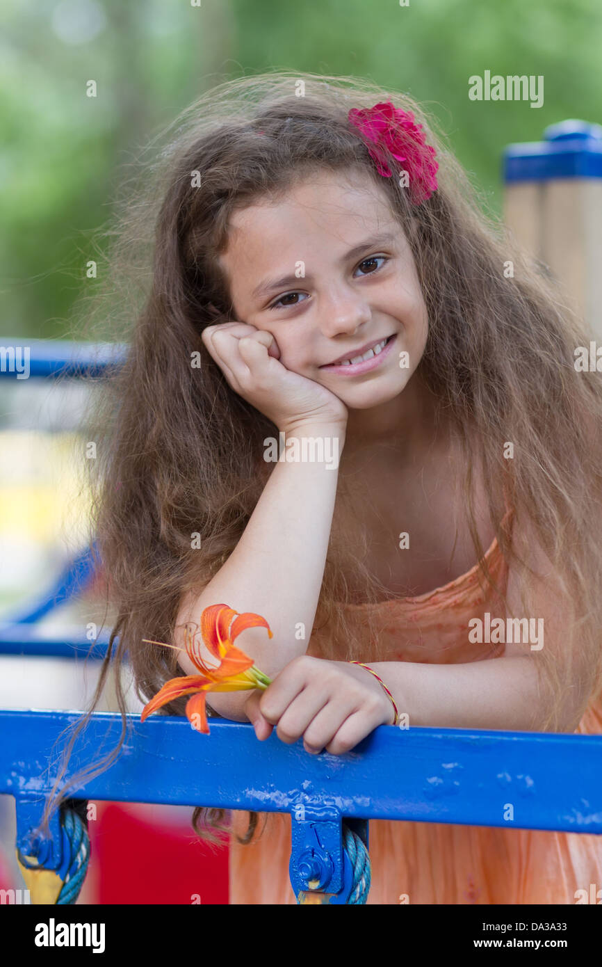 Cute little schoolgirl on the playground at summer day Stock Photo - Alamy