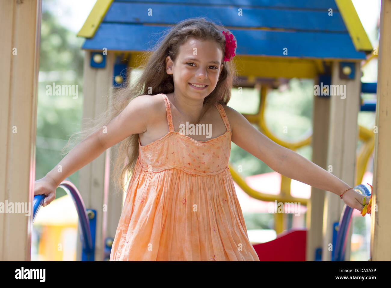 Cute little schoolgirl on the playground at summer day Stock Photo - Alamy