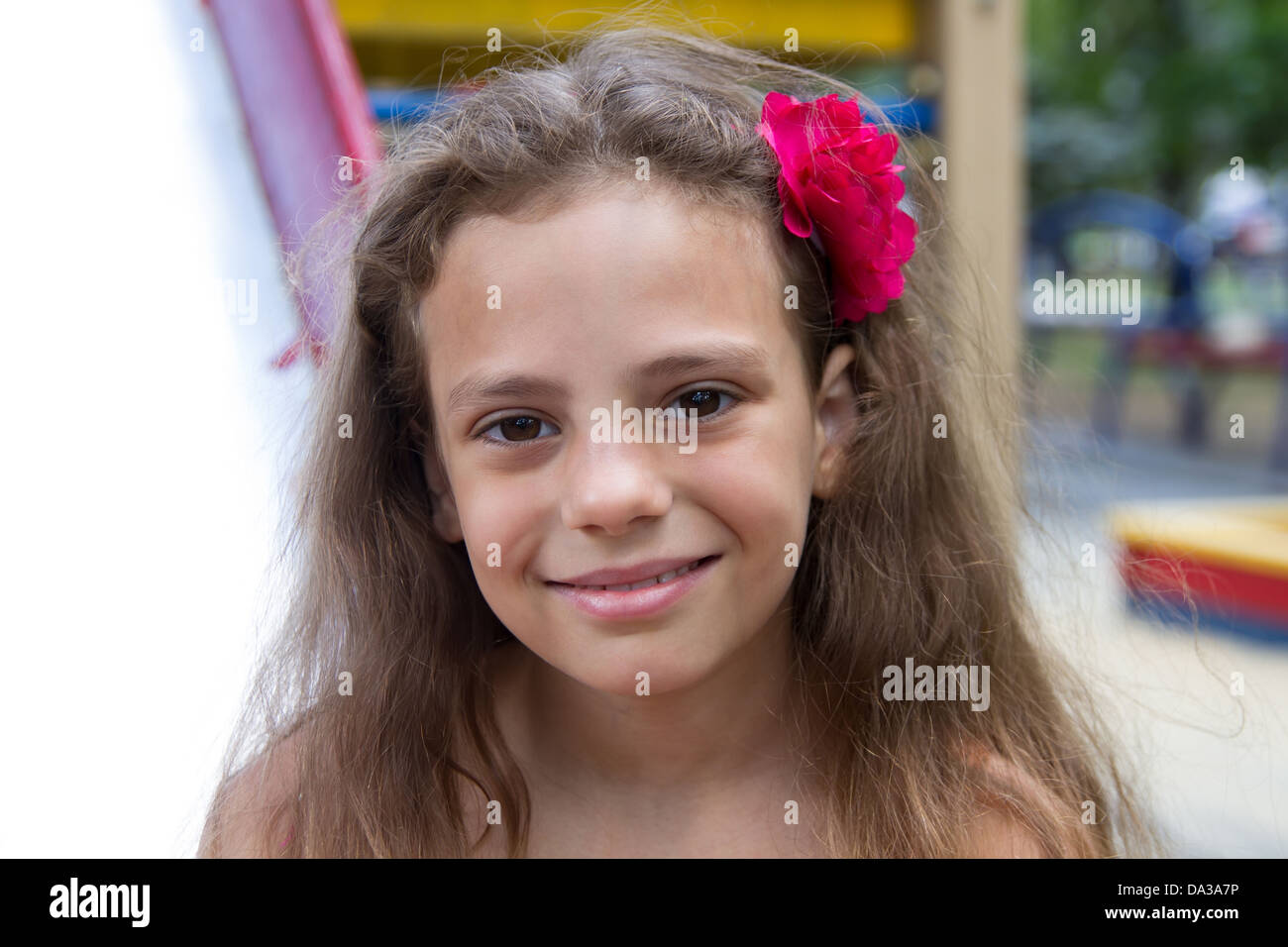 Cute little schoolgirl on the playground at summer day Stock Photo - Alamy