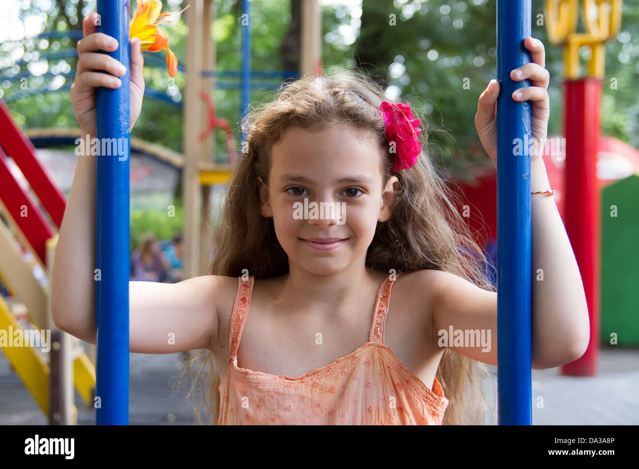 Cute little schoolgirl on the playground at summer day Stock Photo - Alamy