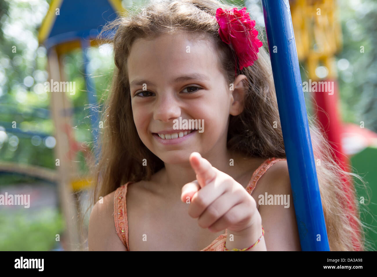Cute little schoolgirl on the playground at summer day Stock Photo - Alamy