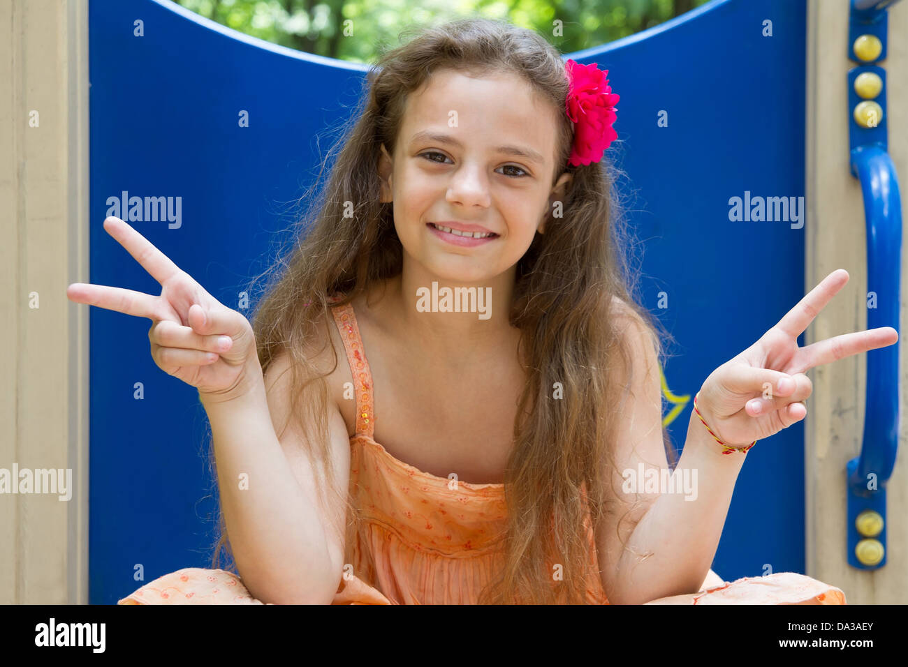 Cute little schoolgirl on the playground at summer day Stock Photo - Alamy