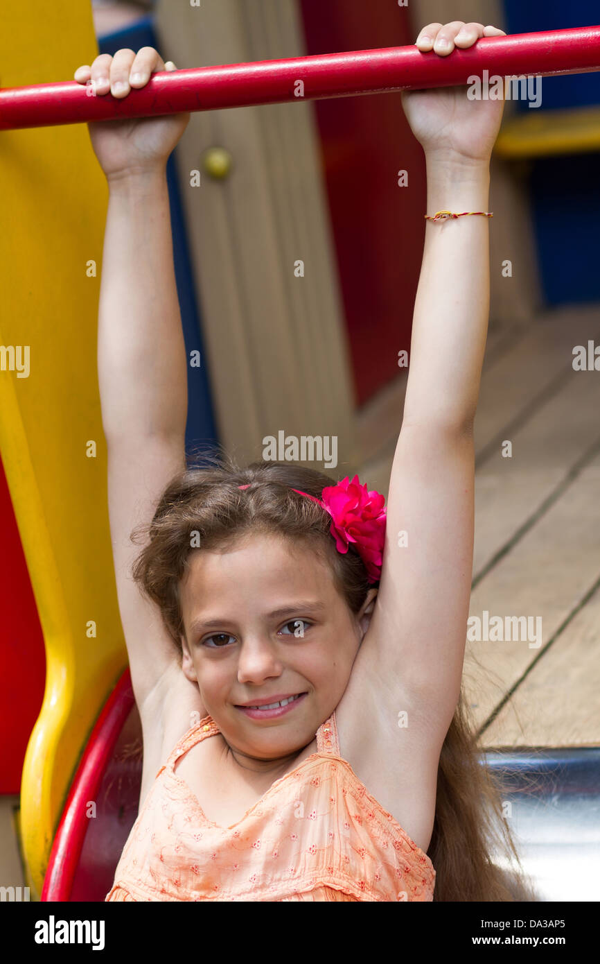 Cute little schoolgirl on the playground at summer day Stock Photo - Alamy