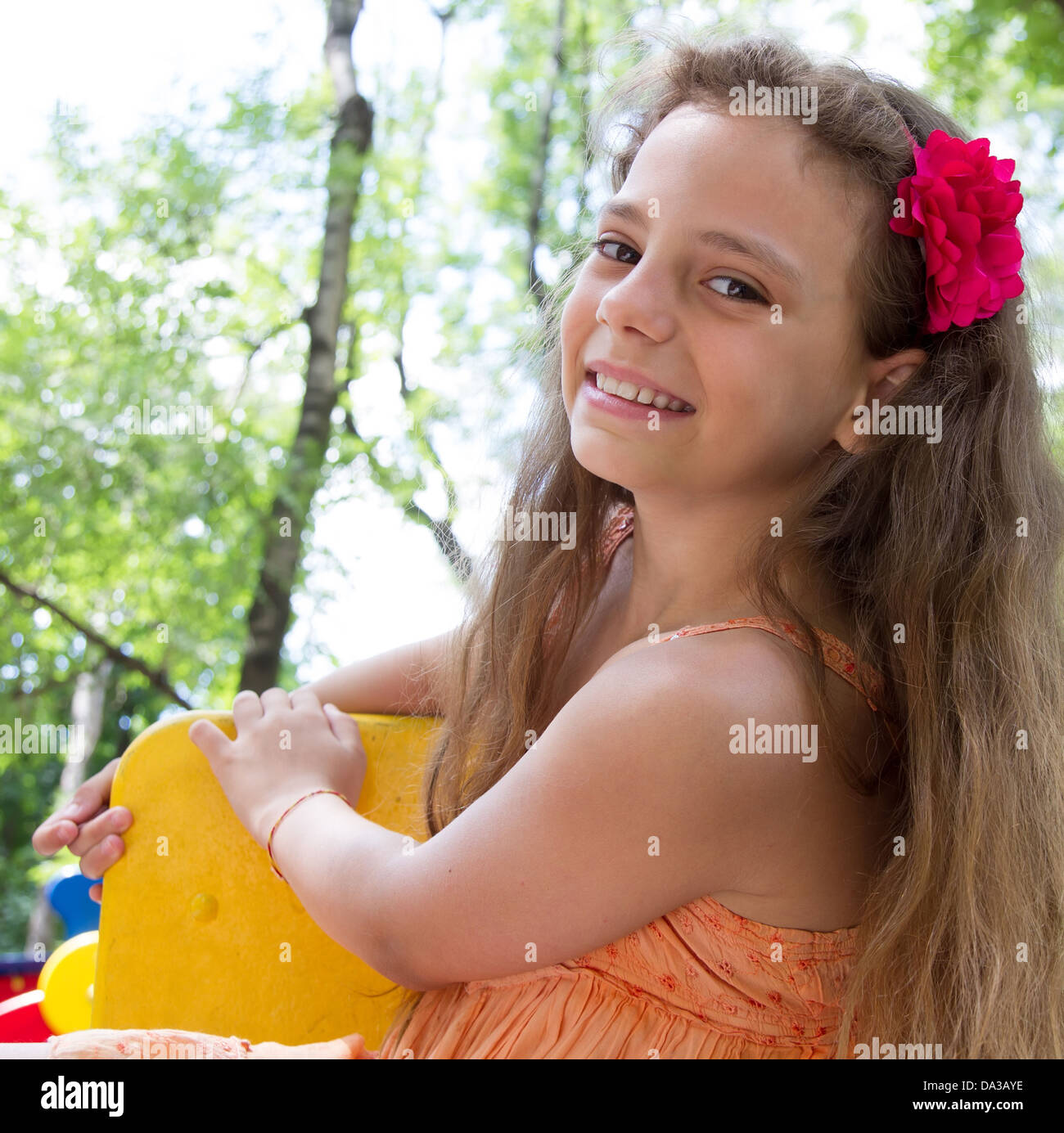 Cute little schoolgirl on the playground at summer day Stock Photo - Alamy