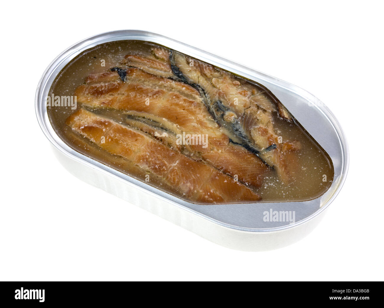 An opened tin of smoked herring fillets on a white background. Stock Photo
