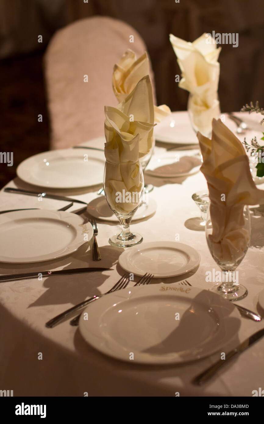 restaurant table set plates glasses Stock Photo