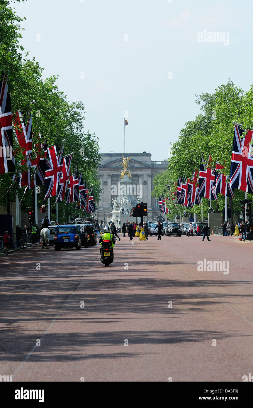 Union Jacks flying in the Mall with Buckingham Palace in the Background