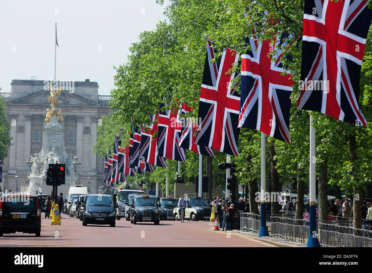 Union Jacks flying in the Mall with Buckingham Palace in the Background