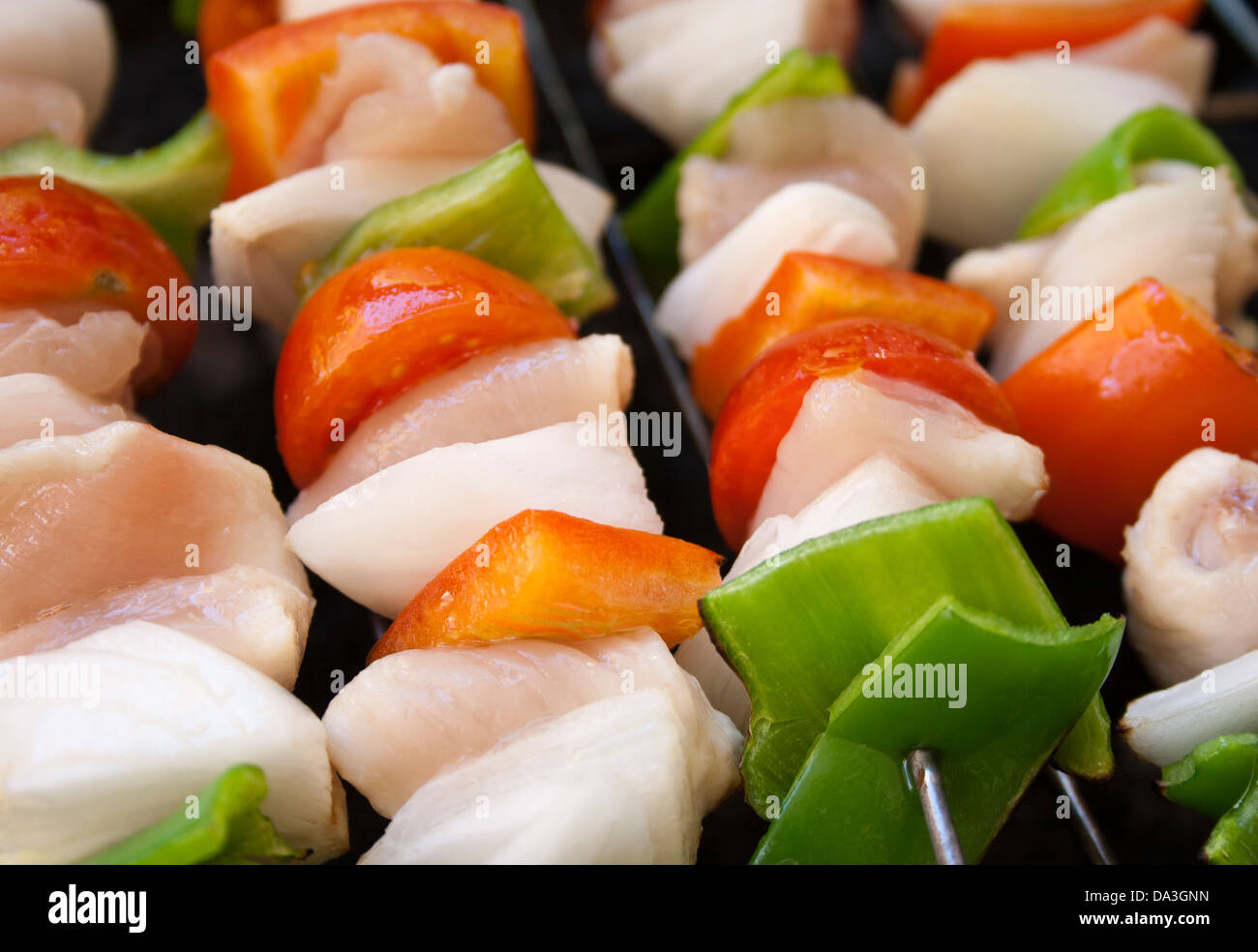 Chicken and vegetable skewers Stock Photo